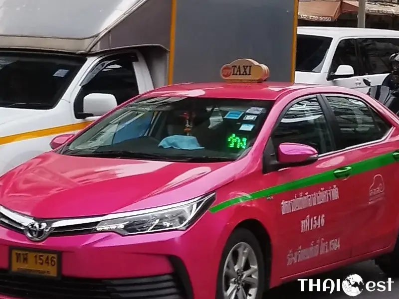 Thai symbols on the front window of free taxi